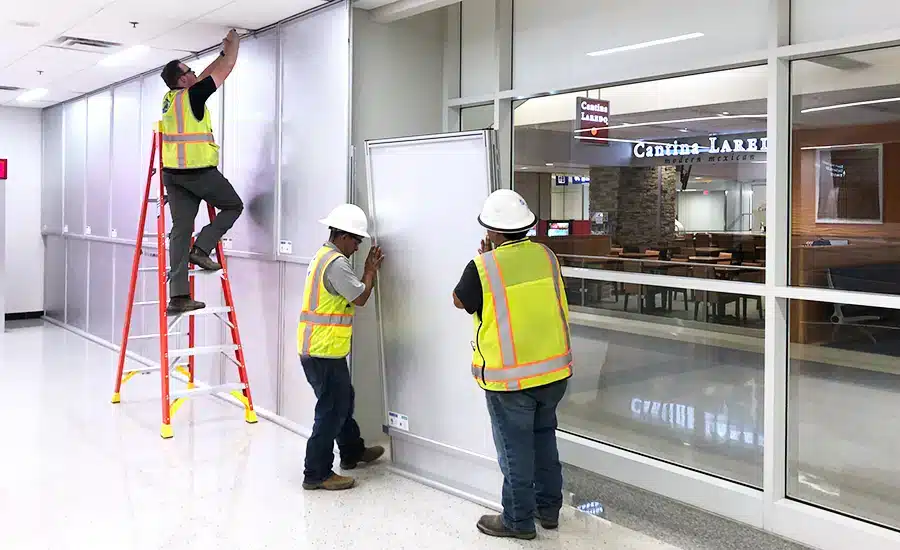 Reusable temporary wall system on active construction site