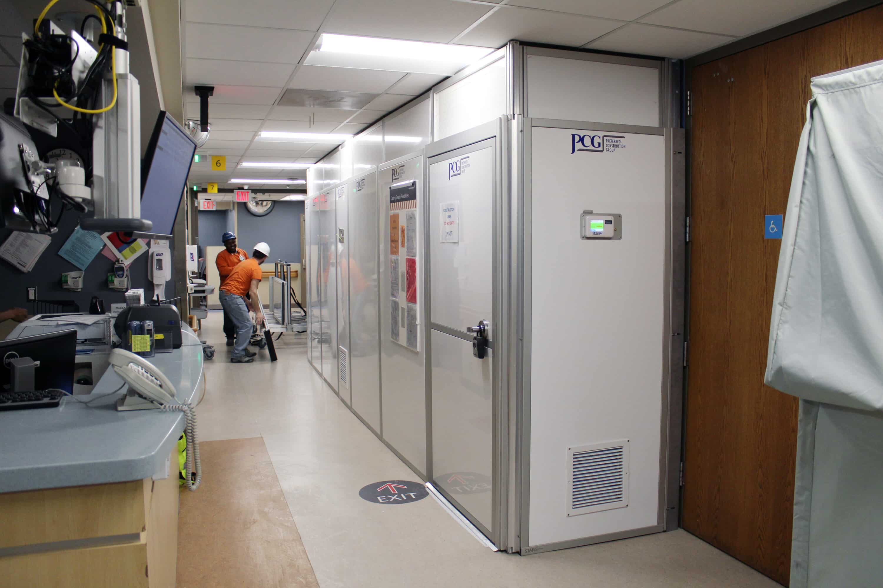 Contractors installing RealWall to protect patients, staff, and visitors during hospital renovations